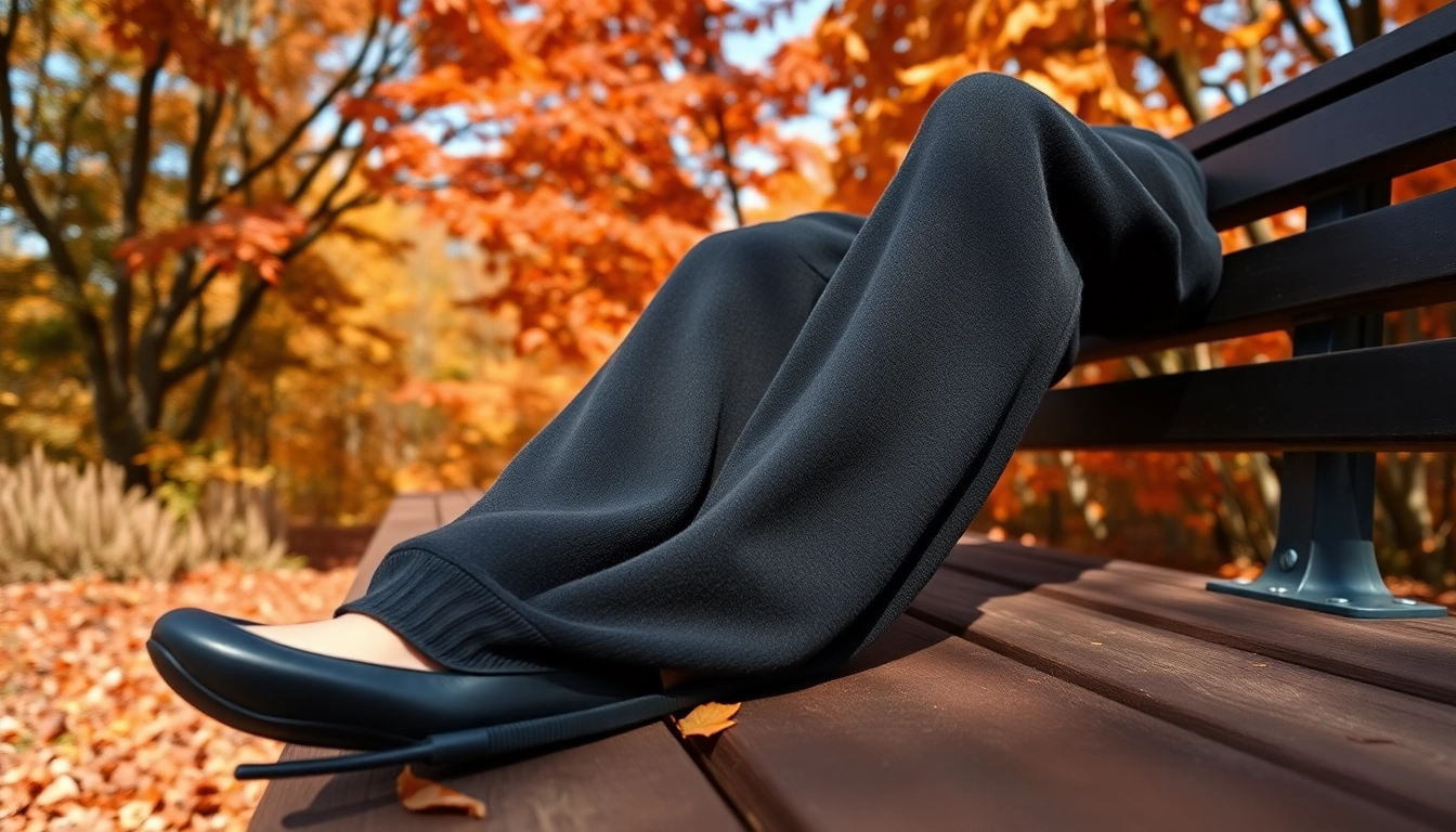 Model showcasing black baggy sweatpants in a stylish autumn setting with vibrant colors.